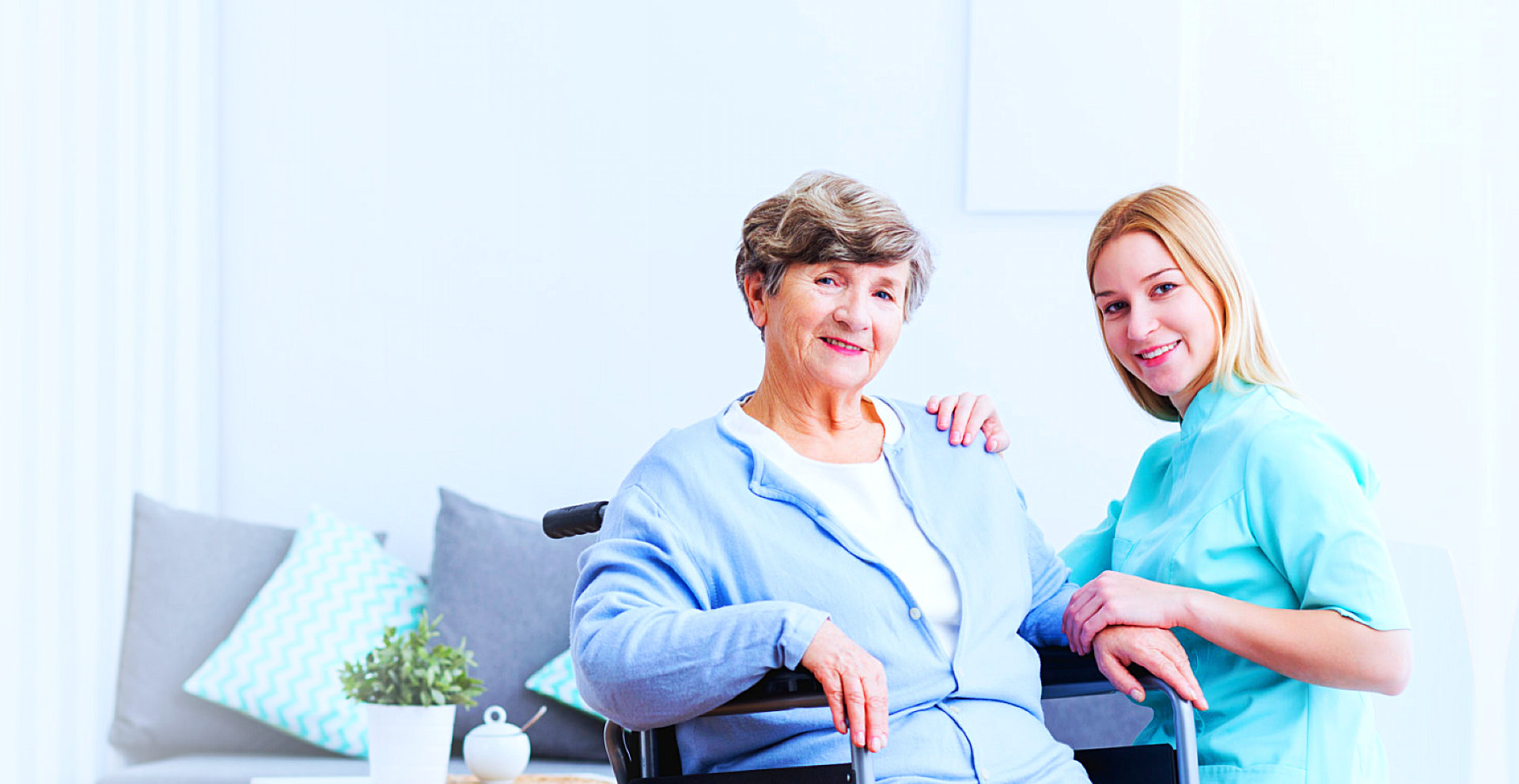 senior woman with caregiver smiling